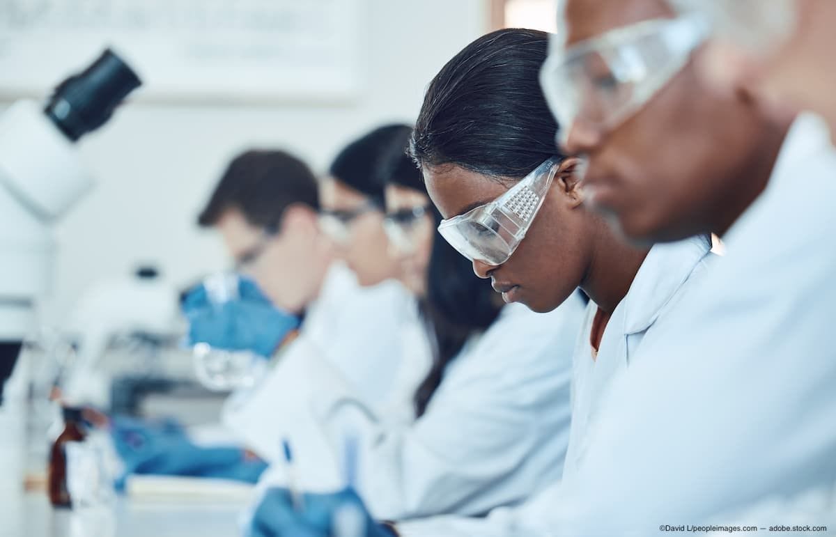 Researchers sitting at table in clinical trial Image Credit: AdobeStock/DavidL/peopleimages.com