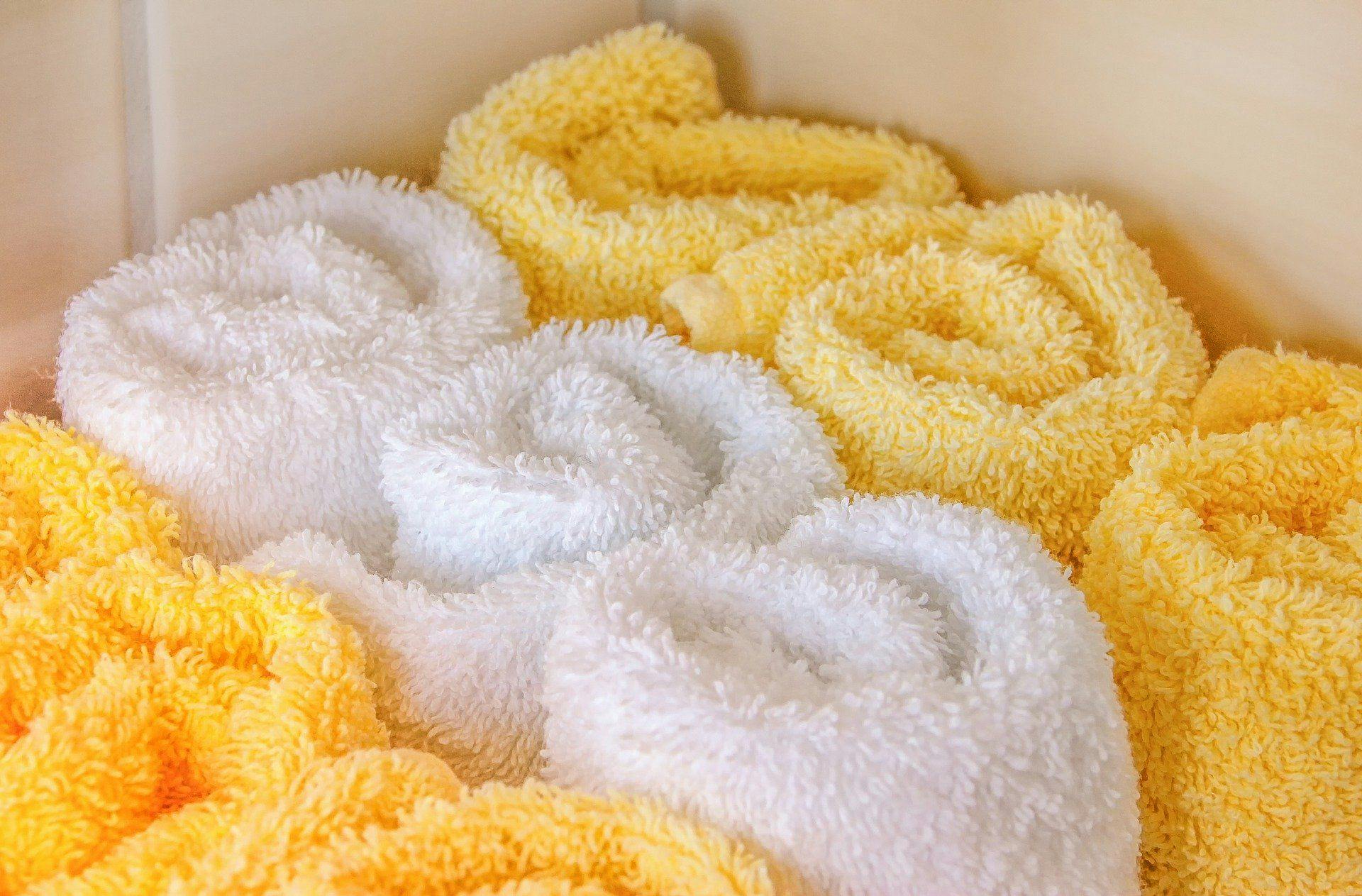 Warm washcloths are rolled up in bundles