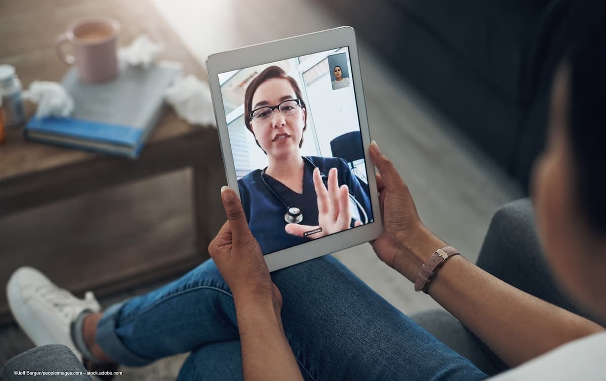 woman calls eye care triage center at Bascom Palmer - Image credit: Adobe Stock/©Jeff Bergen_peopleimages.com