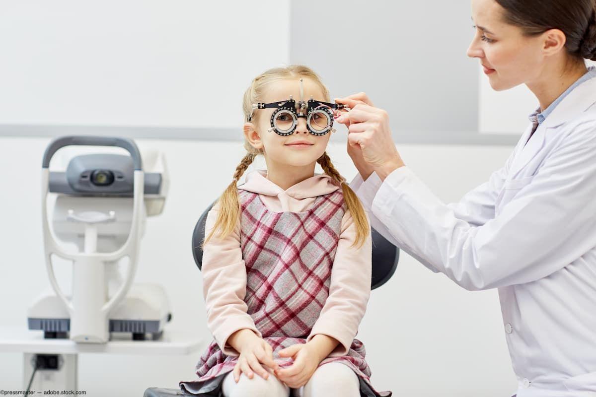 Child sitting in chair getting visual acuity tested by physician Image credit: AdobeStock/pressmaster