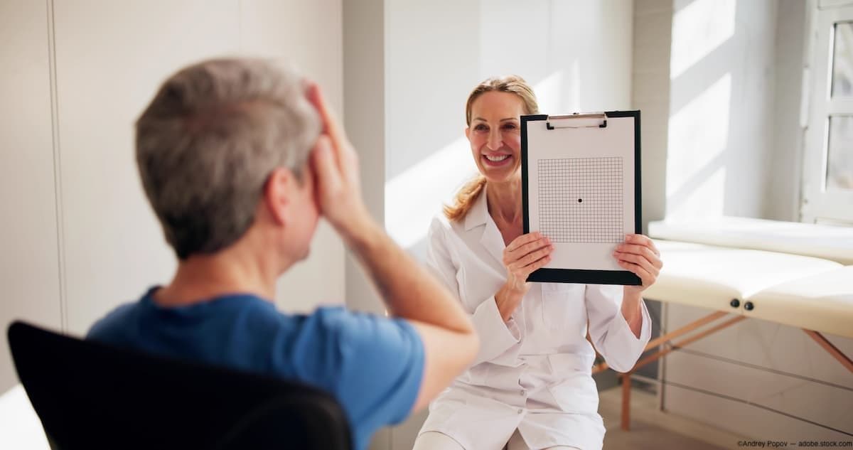 Doctor conducting Amsler grid test with patient Image credit: AdobeStock/AndreyPopov