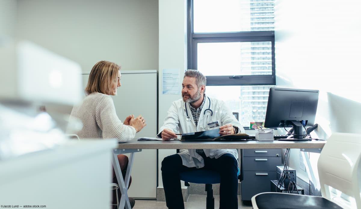 Patient speaking to doctor in office Image credit: ©Jacob Lund - adobe.stock.com