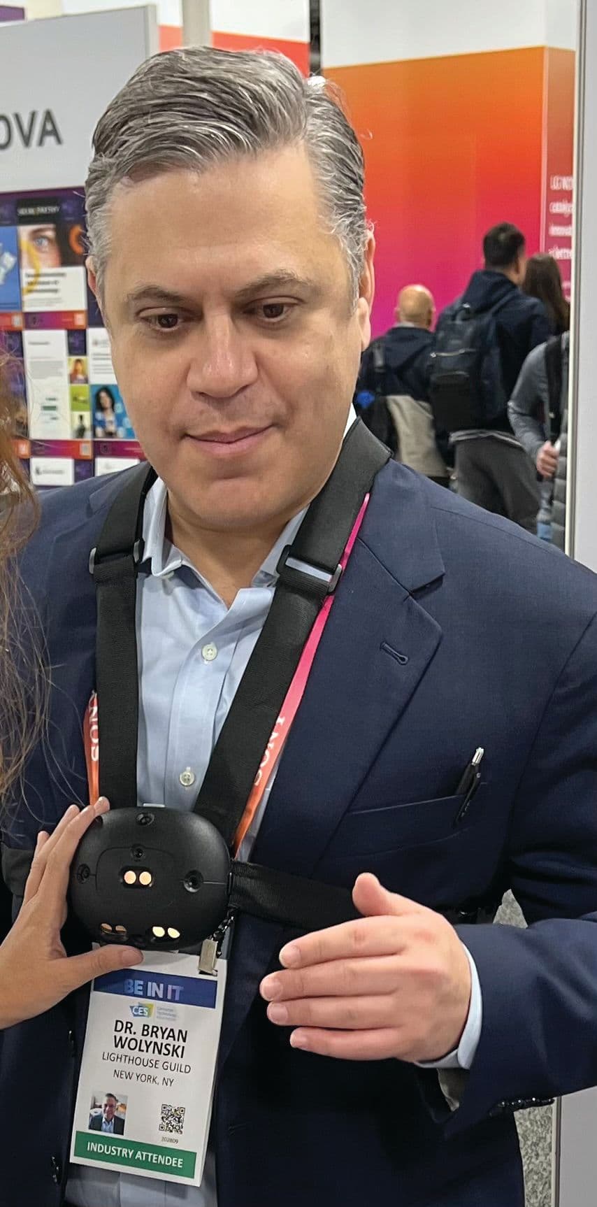 Bryan Wolynski, OD, FAAO, testing out the Ara device by Strap Tech at the Consumer Electronics Show. Image courtesy of Bryan Wolynski, OD, FAAO.