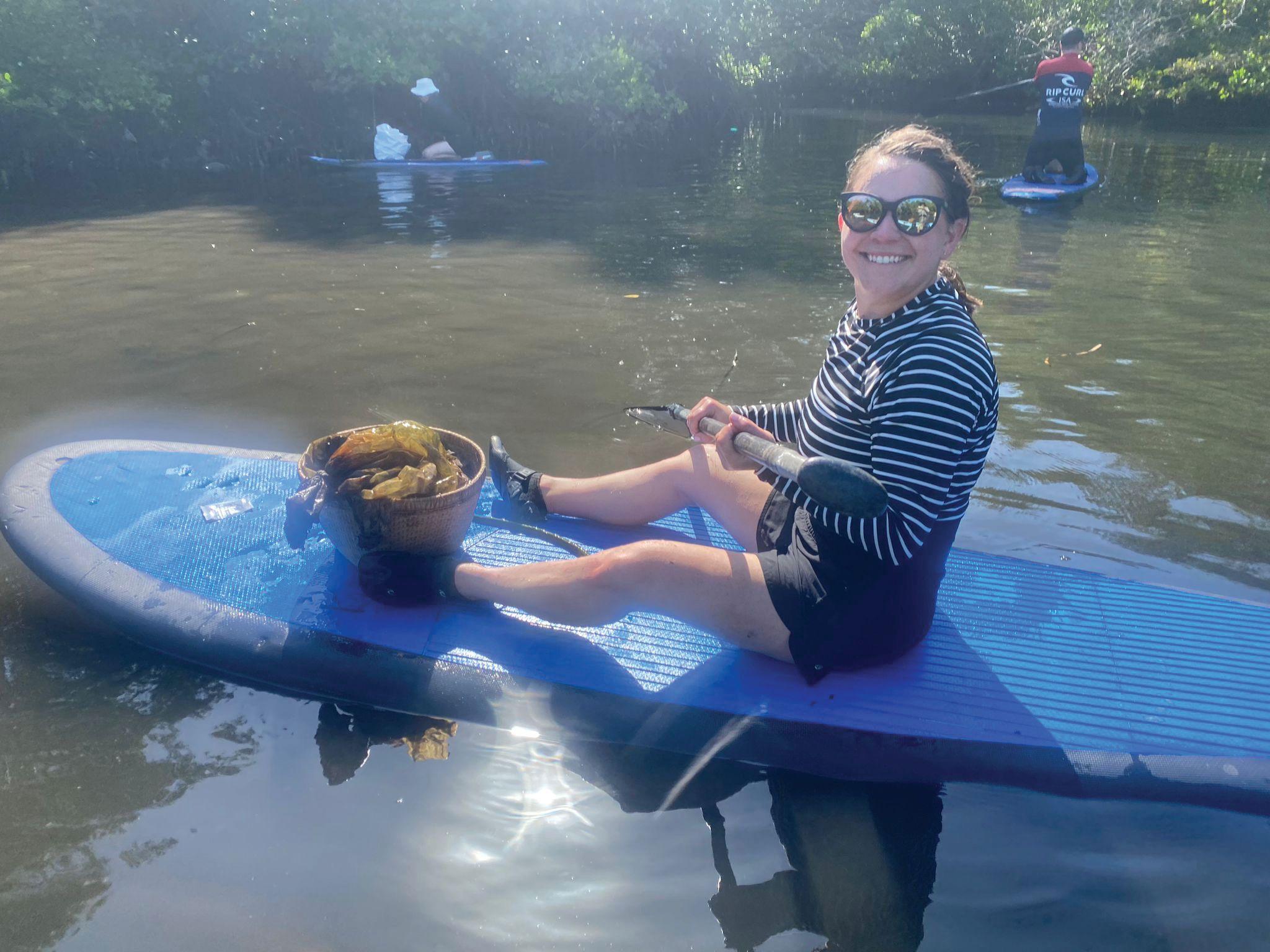 Paddleboarding through the mangroves to collect ocean plastics. Image courtesy of CooperVision.