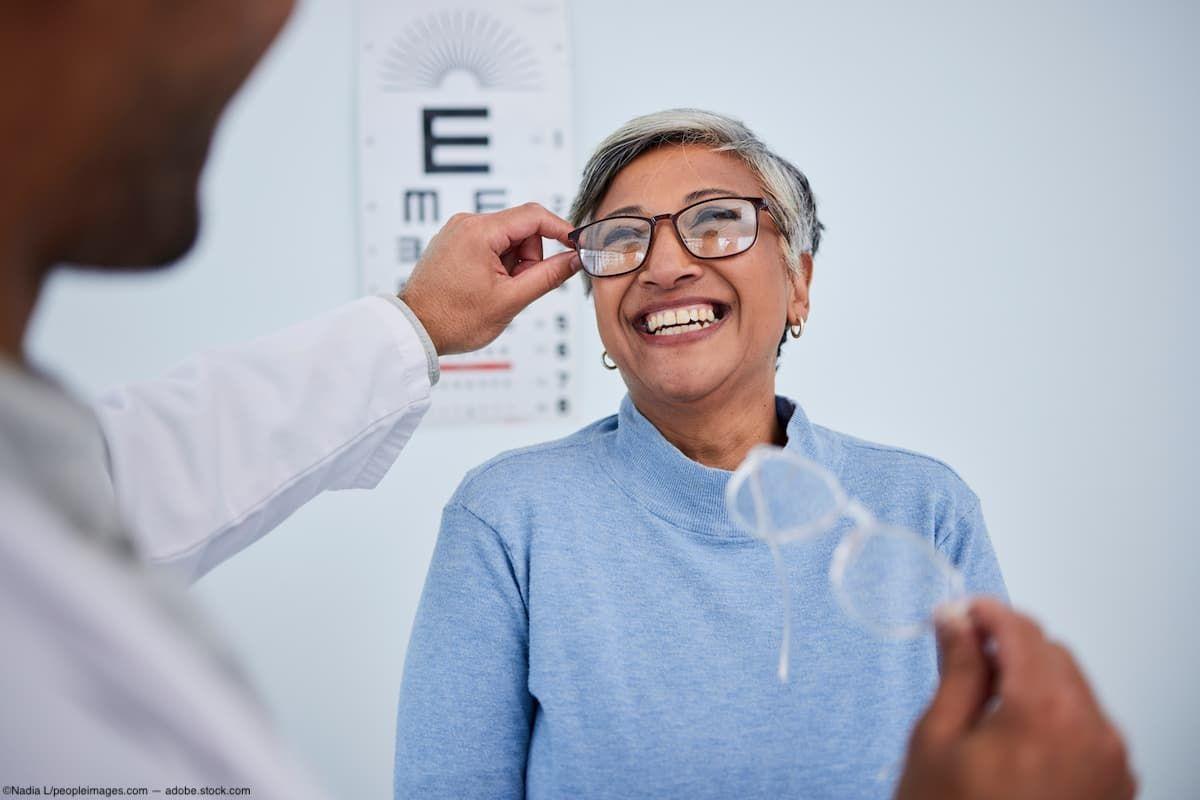 Eye doctor helping patient try on glasses Image credit: AdobeStock/NadiaL/peopleimages.com