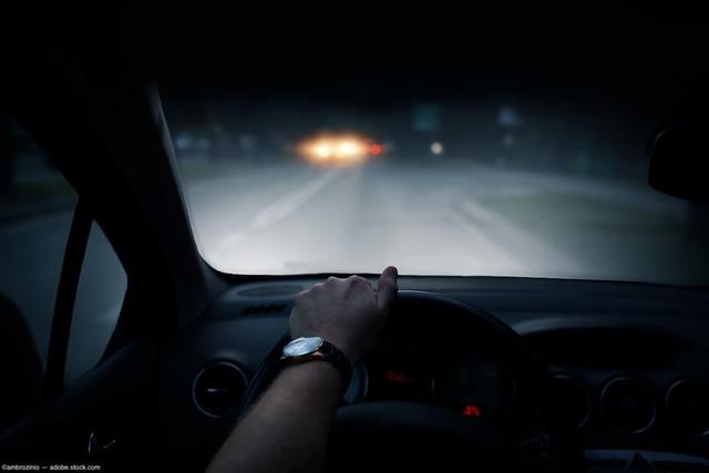 Drivers perspective behind the wheel of a car at night Image credit: ©ambrozinio - adobe.stock.com