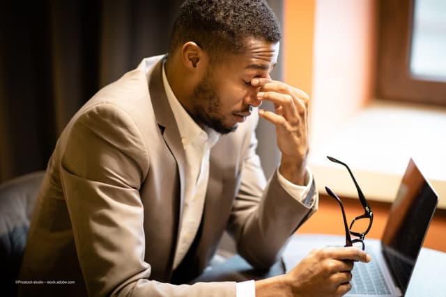 man experiences chronic fatigue following dry eye diagnosis - Image credit: Adobe Stock/©Prostock-studio