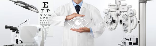 Physician with hands around eye graphic in eye doctor office Image credit: ©amedeoemaja - adobe.stock.com